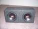 2004 Aston Martin Virage - Dual subwoofer enclosure with two Orion XTR speakers visible on carpet.