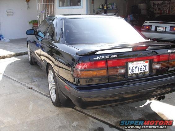 Black 1989 Mazda MX-6 4WS coupe, rear view, California license plate 5GYY620