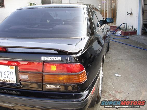 Black 1989 Mazda MX-6 Turbo rear quarter view