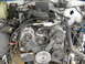 1991 Ford Bronco - Engine bay components including belts, pulleys, and alternator are visible in this close-up view.