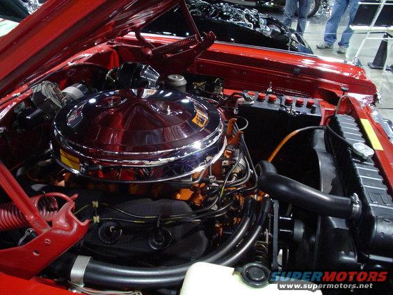 Engine bay with chrome air cleaner and red valve covers