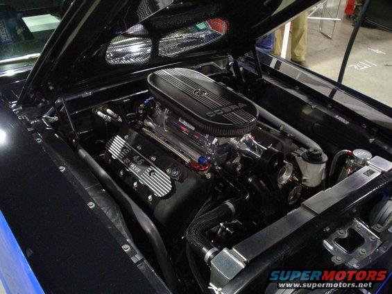 Black engine bay with a Cobra air cleaner and a 4.6 32 valve engine
