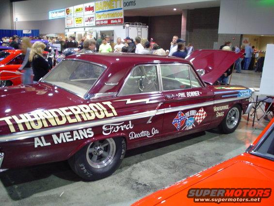 Maroon Ford Thunderbolt drag car with "AL MEANS" and "THUNDERBOLT" text, and various racing decals