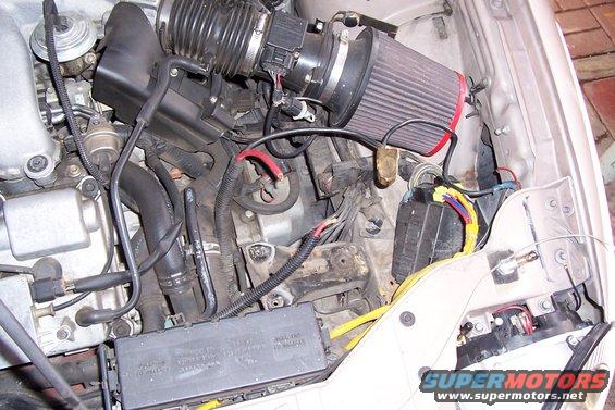 Engine bay with aftermarket air filter and wiring