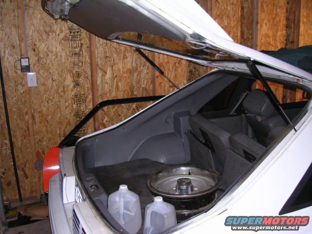 Replaced the hatch shocks. It stands up on it's own now.