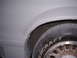 1988 Ford Mustang - Detail shot of a tire and wheel well, with "SUPERMOTORS" branding on the tire.
