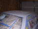 1988 Ford Mustang - A car's roof is taped off with newspaper and blue tape, ready for a fresh coat of primer.