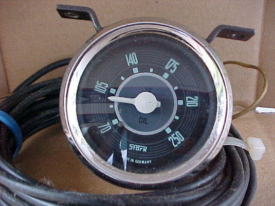 STÖBER oil temperature gauge with chrome bezel, black face, and white needle. Marked 'OIL' and 'MADE IN GERMANY'
