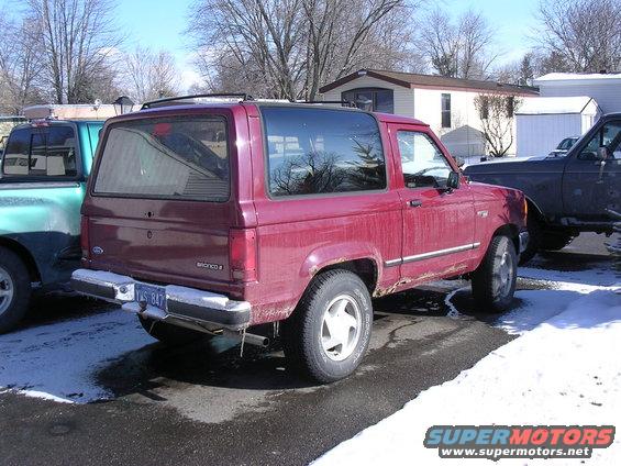 Red 1989 Ford Bronco II, rear 3/4 view
