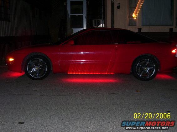 red coupe with red underglow lights on the side