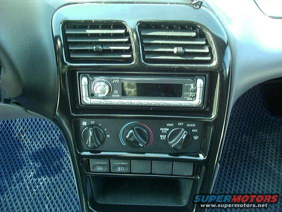 car dashboard with JVC stereo, climate controls, and vents