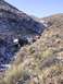 1978 Ford Bronco - Several 4x4 vehicles are seen on a challenging, snow-dusted trail in a mountainous area.