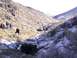 1978 Ford Bronco - A convoy of off-road vehicles navigates a rocky, snow-dusted canyon trail.