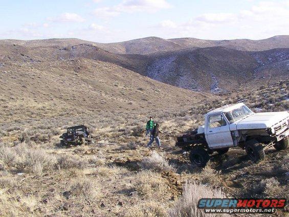 1978 Ford Bronco parked on a dirt road in a desert landscape