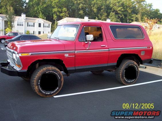Red Ford Bronco parked in a lot. Has BFGoodrich tires