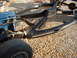1964 Ford Galaxie - Close-up of a vehicle's chassis and engine components on a gravel surface.