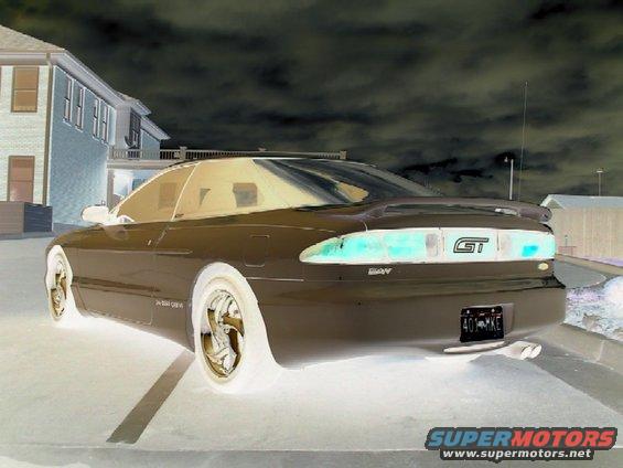 1996 Ford Probe GT rear view with GT badge on taillight panel and license plate 401-MXE