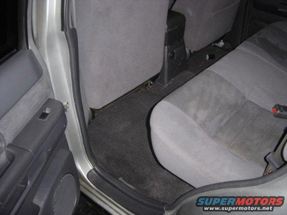 Interior view of vehicle rear seats and door panel