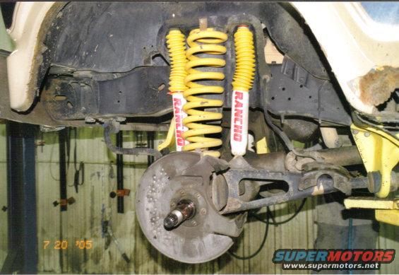 Front suspension with yellow Rancho shocks and springs. Date stamp '7 20 '05'