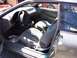 1996 Ford Probe - The interior of a car is shown, with a Viper sticker visible on the rear passenger window.