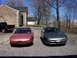 1996 Ford Probe - Two Ford Probes, a rose metallic and a gray model, are parked side-by-side in a driveway.
