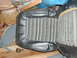 1979 Ford Bronco - A close-up view of a vintage car seat with a distinctive striped fabric pattern.