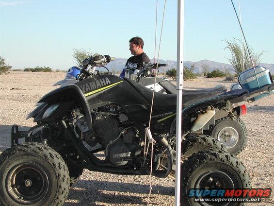 2004 Yamaha RAPTOR 660 parked next to another ATV in a desert