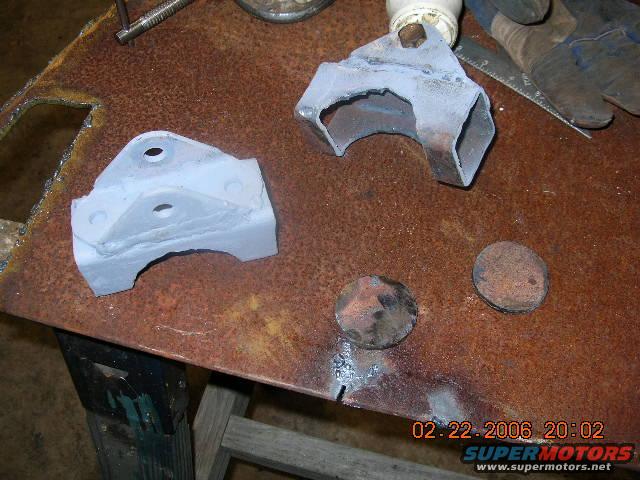 truck-034.jpg Shock mounts..The circles are peices I cut out to go in the hole where the original coil spring sat, they serve as the upper mount for the shocks. I used the factory TTB mounts welded onto some 2" square tube to make the lower