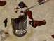 1979 Ford Bronco - A screwdriver is used to break apart a shattered brown glass bottle on a concrete surface.