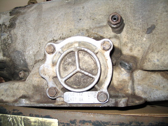 Transmission part with metal tag showing P6D-112 8944F E4TP UA
