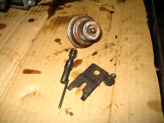 Transmission vacuum modulator and linkage on a cardboard surface