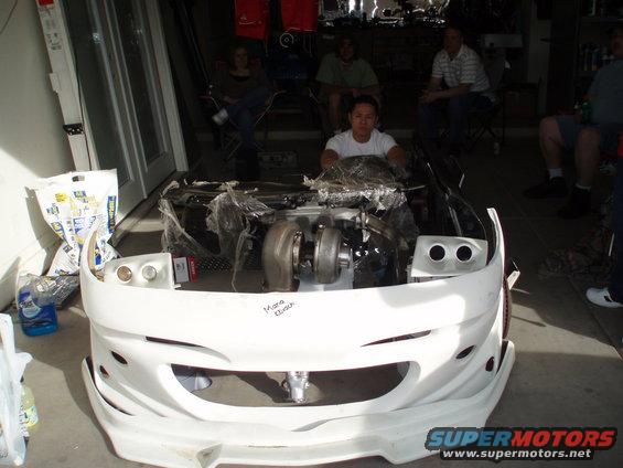 Pretty car... that's a aftermarket probe bumper, projectors, intake manifold, turbo, dash, side skirts, exhaust, sub, and amp... complete with driver and steering wheel