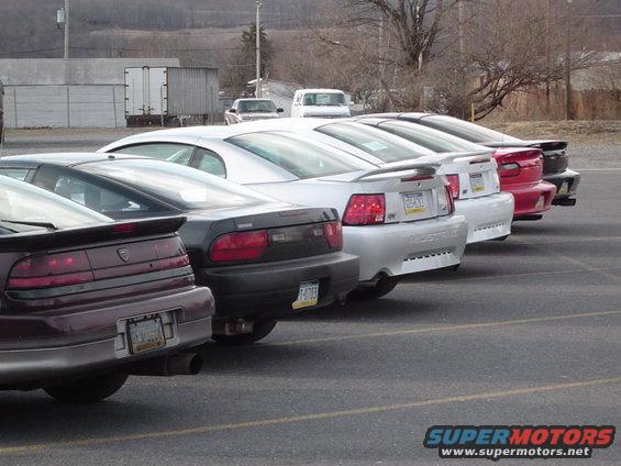 Silver Ford Mustang with a spoiler and a license plate