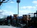 1997 Ford Escort - A street view shows an observation tower and several buildings, including Boston Pizza restaurants, with cars driving by.
