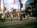 1997 Ford Escort - A busy street scene in Toronto, Canada, with pedestrians crossing the street and buildings lining the road.
