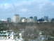 1997 Ford Escort - A view of a city skyline various buildings and trees, with some houses in the foreground.