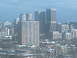 1997 Ford Escort - A view of a city skyline numerous buildings of varying heights and architectural styles.