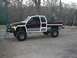 2001 Dodge 1500 - This 2001 Dodge 1500 pickup truck features a two-tone paint scheme and an elevated suspension system.