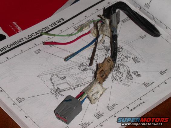 Wiring harness with gray connector and colored wires lies on a diagram labeled 'COMPONENT LOCATION VIEWS'