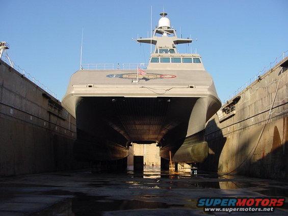Military catamaran in dry dock, viewed from the front