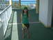 2003 Yamaha RAPTOR 80 - Girl in Jamaica-themed outfit poses on a balcony overlooking the ocean.