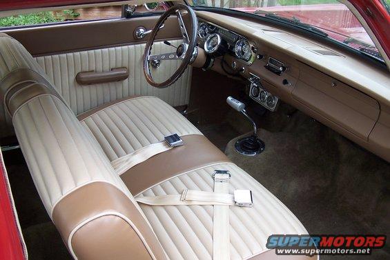 1965 Ford Falcon interior with beige and brown seats, dashboard, and steering wheel