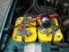 1993 Ford Bronco - Dual yellow Optima batteries are installed in the engine bay, with a blue circle highlighting a terminal connection.