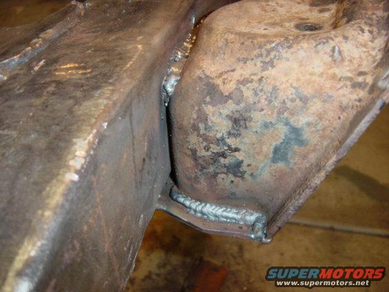 Close-up of two metal frame pieces joined by welds