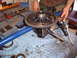 1988 Ford Bronco - Differential gear assembly and tools laid out on a blue shop towel for repair.