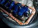 1966 Ford Fairlane - Close-up view of an engine's valve train, blue aluminum valve covers and springs, with a Victor Reinz gasket visible.