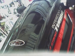 Black and red jet ski part with 'INTERCOOLED TURBO' text and a circular badge