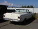1961 Ford Ranchero - Rear view of a 1961 Ford Ranchero pickup truck parked in a lot.