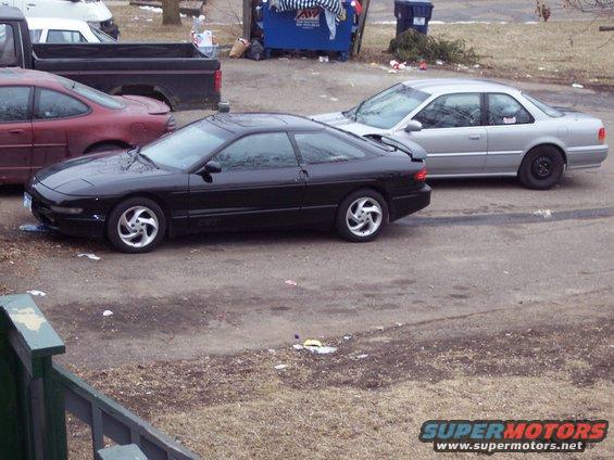 Black 1995 Ford Probe GT coupe, side view