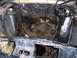 1967 Ford Mustang - The engine bay of a vehicle, showing the exhaust system and various hoses and wiring.